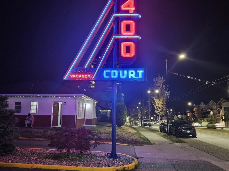 neon sign 2400 motel by night