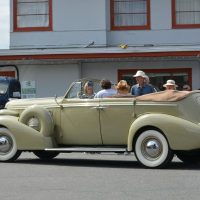Visitors enjoying annual vintage car show at East Vancouver motel