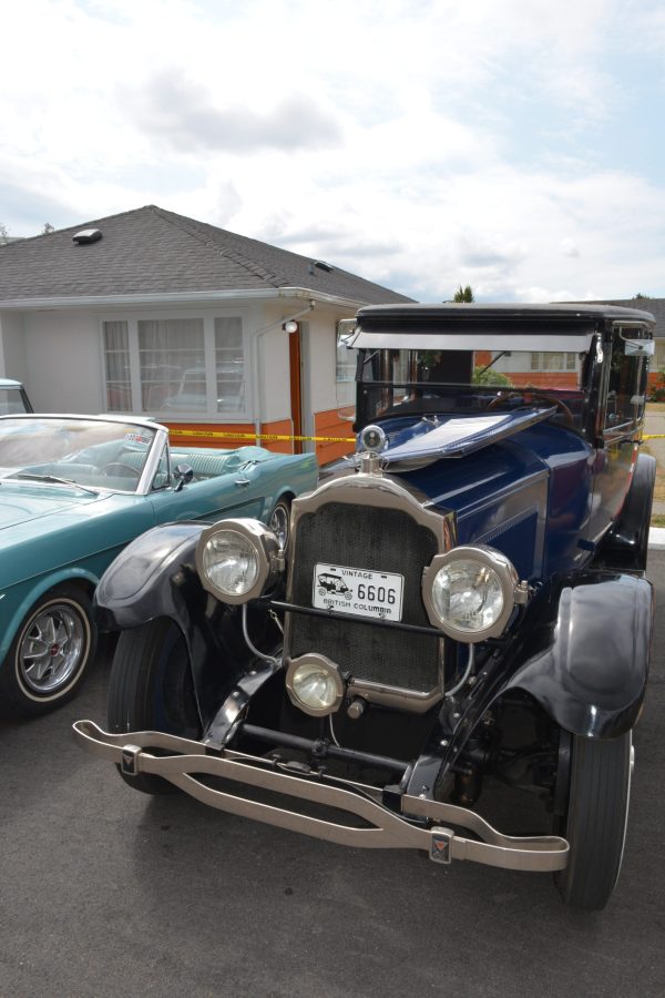 Retro vehicles displayed outside 2400 Motel bungalows
